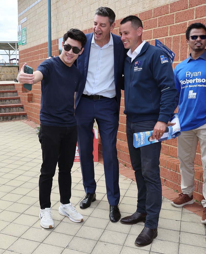 Liberal candidate Ryan Robertson and WA Liberal leader Basil Zempilas with a voter at Secret Harbour Primary School.