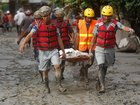 Security personnel collect the bodies of flood victims in Nuwakot, Nepal, on August 27, 2026, following an outburst of a glacial lake in Tibet. 