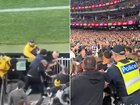 Pies fans turned on each other in violent clashes at the MCG on Friday night.