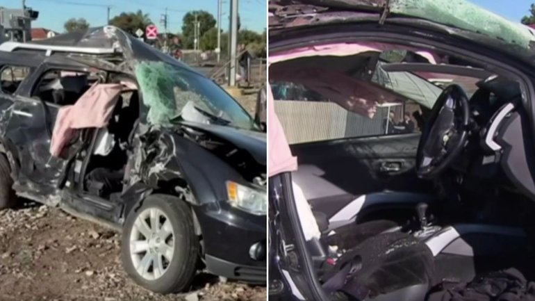 A 26-year-old man was taken to  hospital with a suspected broken arm after his car entered a level crossing and was hit by a train