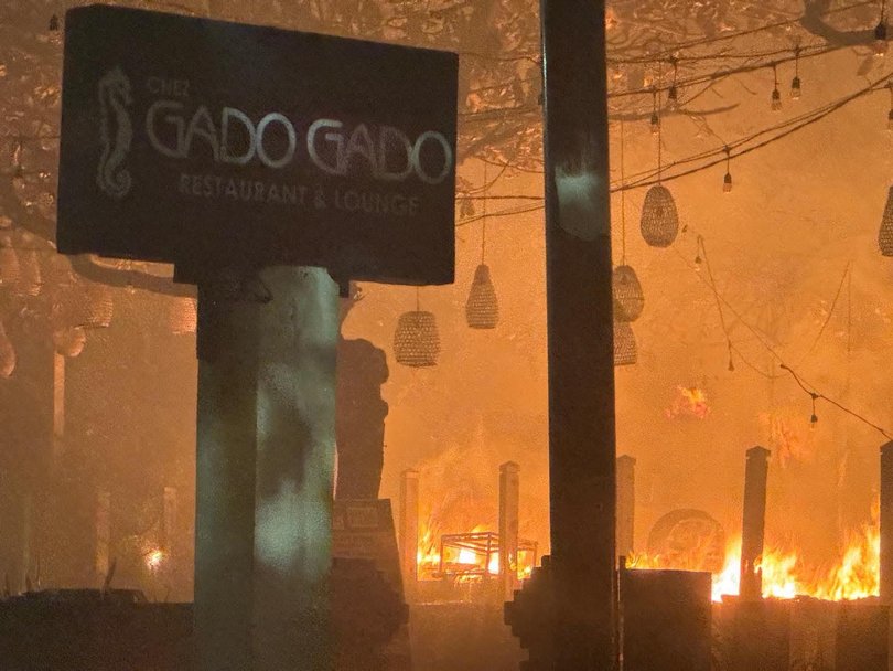 Restaurant Chez Gado Gado was pictured engullfed in flames.