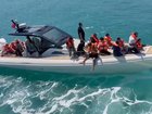 Rescuers scrambled to save passengers from the ferry after it capsized. (AP PHOTO)