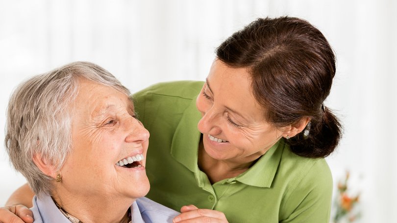Senior woman with her home caregiver