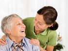 Senior woman with her home caregiver