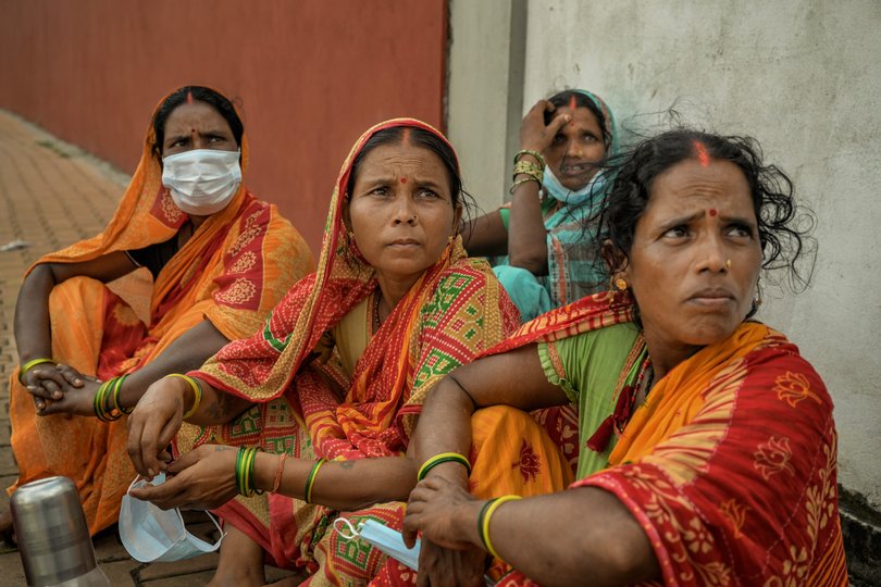 Relatives of victims outside a makeshift morgue in Bharatpur, Nepal, on Sunday, Aug. 30, 2026. Five days after an angry deluge tore through the mountain passes of Nepal, family members arriving after long journeys looked for something — anything — that could identify their loved ones amid the hundreds of mangled bodies. (Atul Loke/The New York Times)