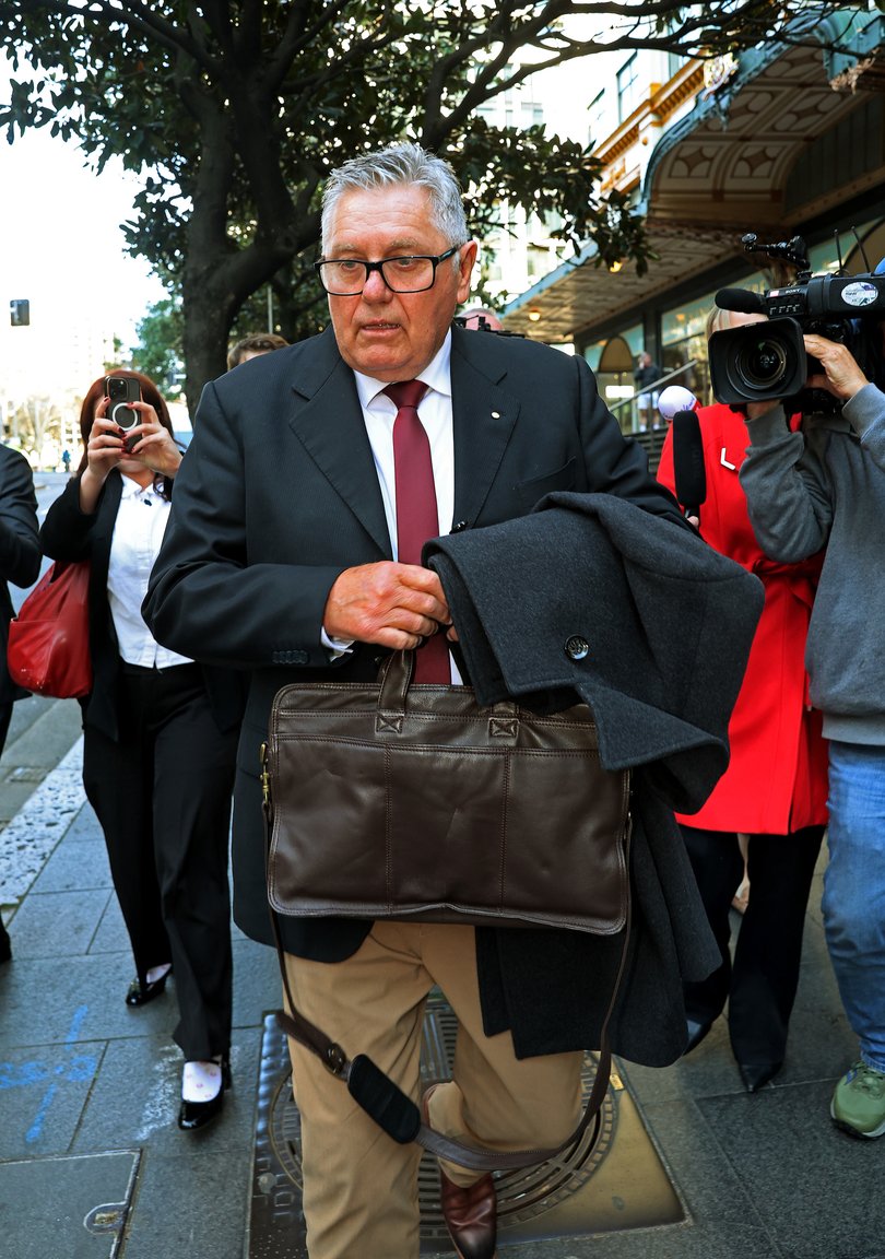 Former broadcaster Ray Hadley leaves Downing Centre Court after appearing as a star witness.