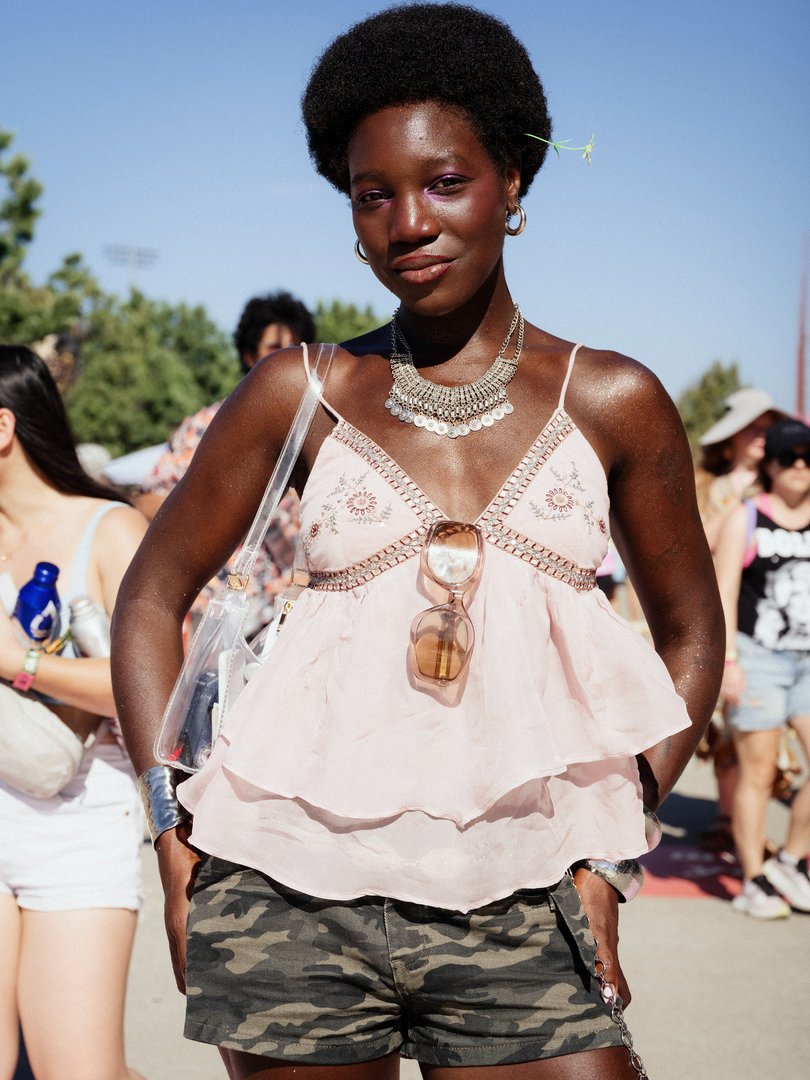 A concert-goer at the inaugural Daisy Chain Fields, a sold-out, one-day festival in Irvine, Calif., on Saturday, Aug. 29, 2026. The music festival was created by Olivia Rodrigo to raise money for women-oriented charities and to spotlight female artists like the pop supernova Chappell Roan, the hip-hop firebrand Doechii and the pioneering punk band Bikini Kill. (Amanda Hakan/The New York Times)
