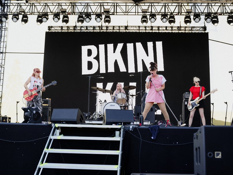 The band Bikini Kill performs.