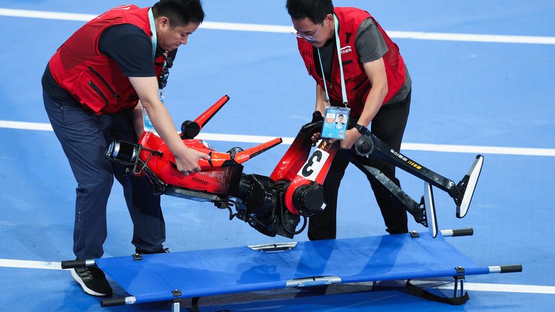 A humanoid crashes out during a race in Beijing, China. 