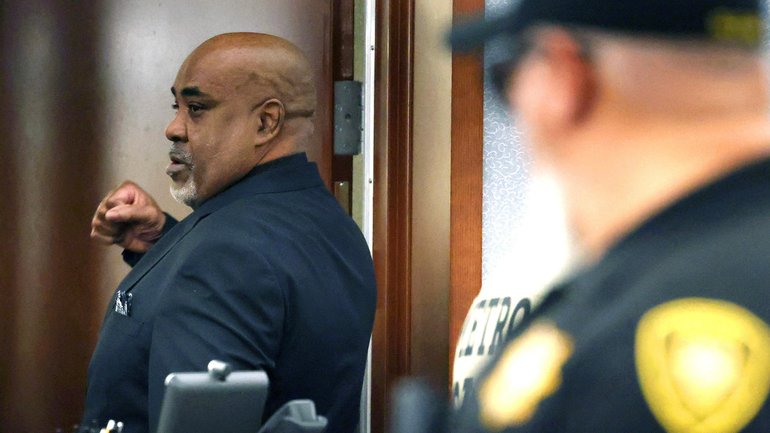Duane Davis pumps his fist as he is led out of a courtroom after a jury found him guilty in the 1996 killing of rapper Tupac Shakur, in Clark County District Court at the Regional Justice Center in Las Vegas.