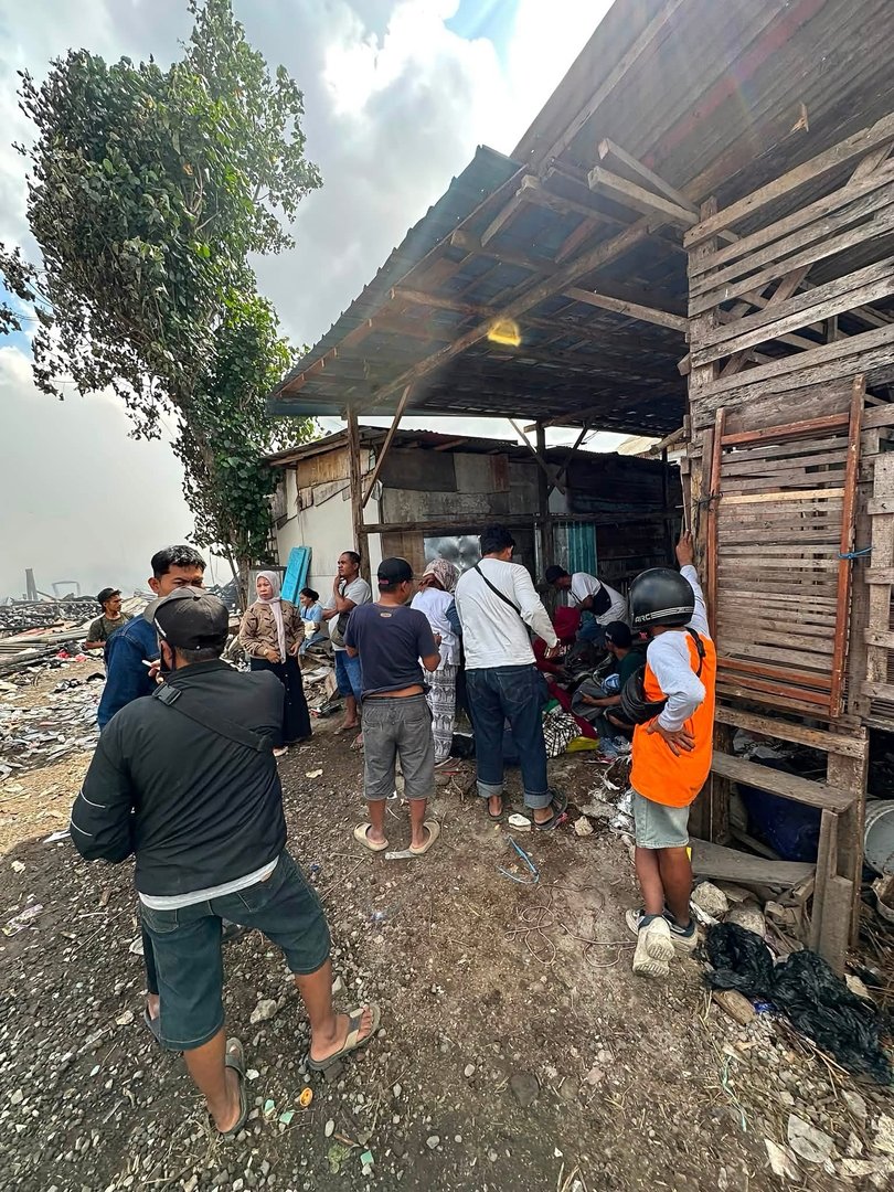 A photo of some of the affected residents at the scene of the fire on Tuesday.