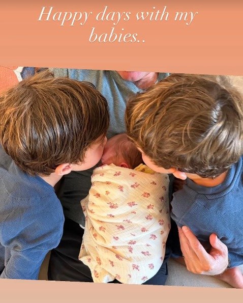 The brothers are also pictured giving their sister a sweet kiss on her cheeks.