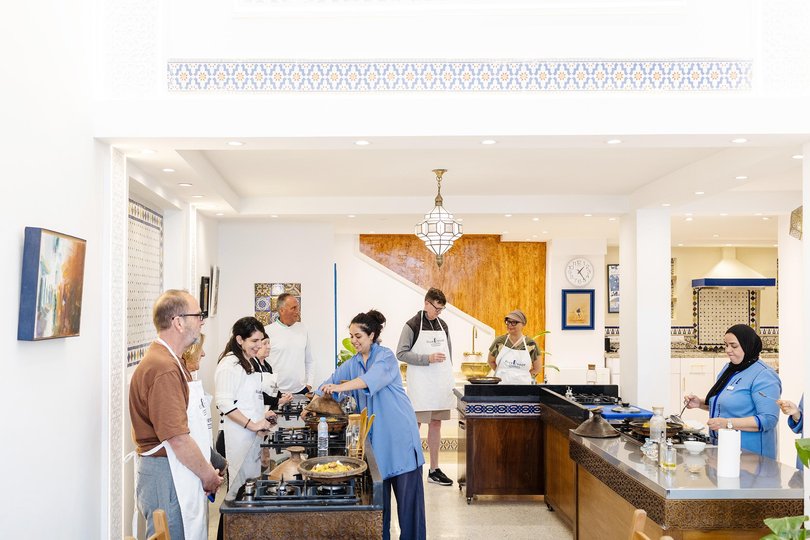 Passengers make chicken tagine at Blue Door Cuisine in Tangier, Morocco.