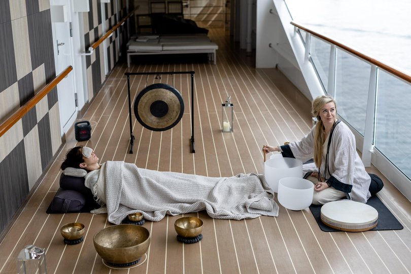 A sound bath session on the deck conducted by Carlie Barlow.