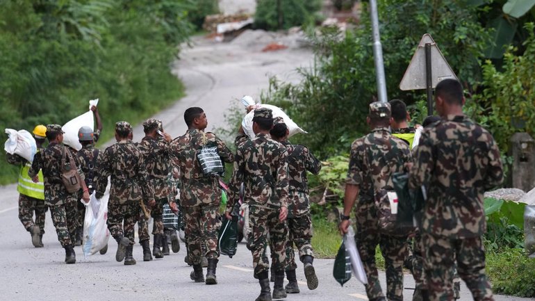 Rescuers in Nepal are contending with collapsed tunnels and floodwaters that make access difficult. 