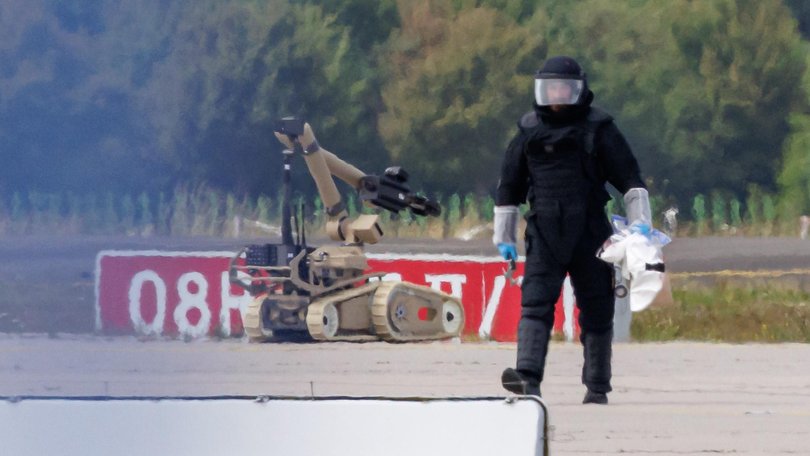 Police use a bomb-detonating robot after a collision with a Ukrainian plane at Leipzig/Halle Airport earlier this month.