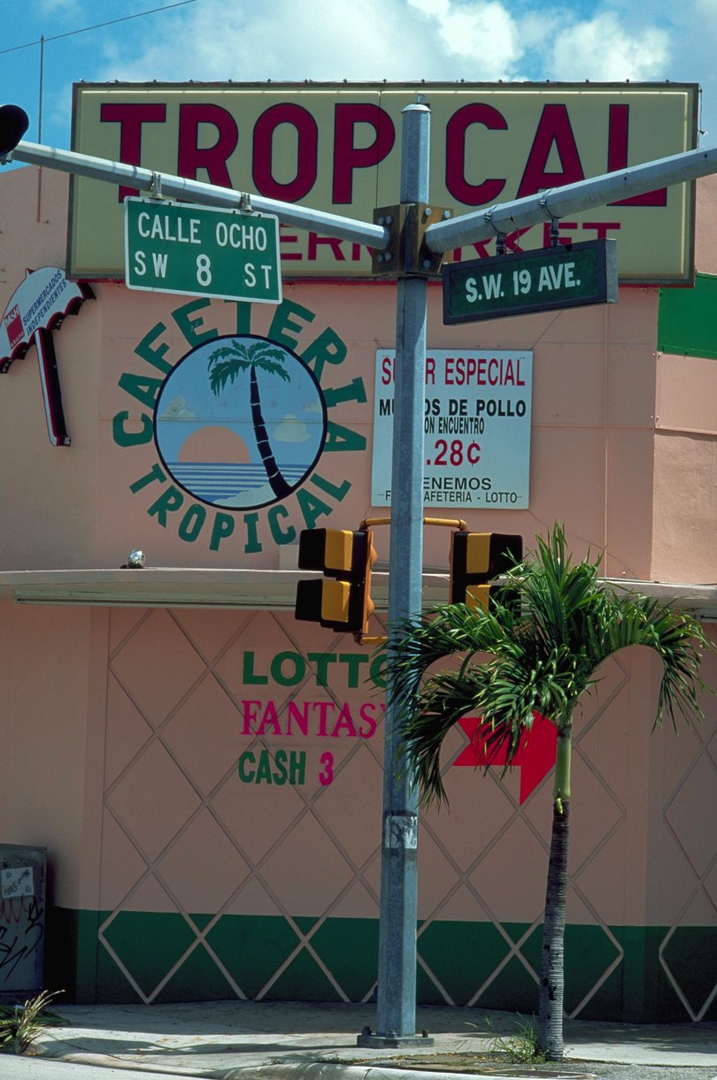 Traffic signs stand written in Spanish and English in Little Havana, Miami.
