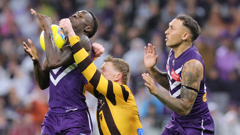 Michael Frederick feels the pressure from James Sicily.