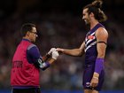 Alex Pearce of the Dockers gets his finger seen to by the doctor.