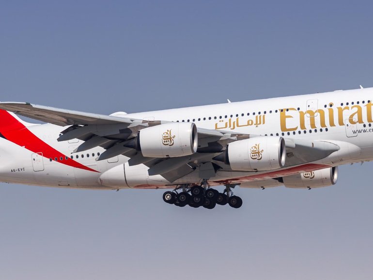 An international flight bound for Sydney has been thrown into chaos after passengers were forced to tied a man to his seat after he allegedly began acting erratically.