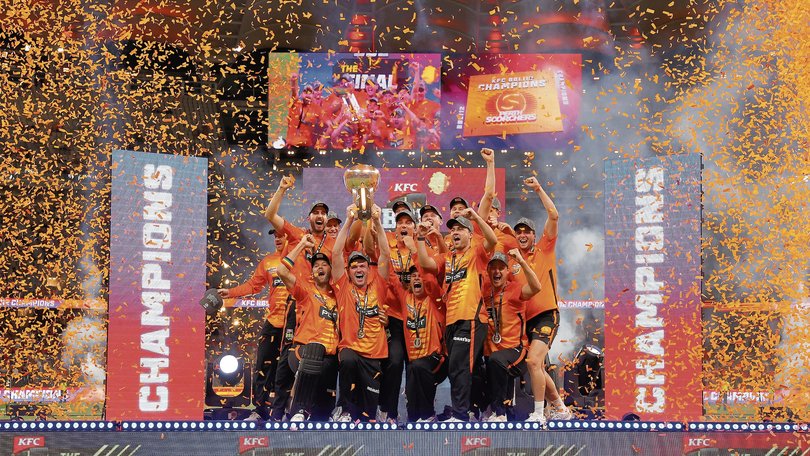 The Scorchers celebrate with the trophy.