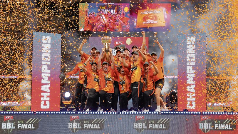 The Scorchers celebrate with the trophy.