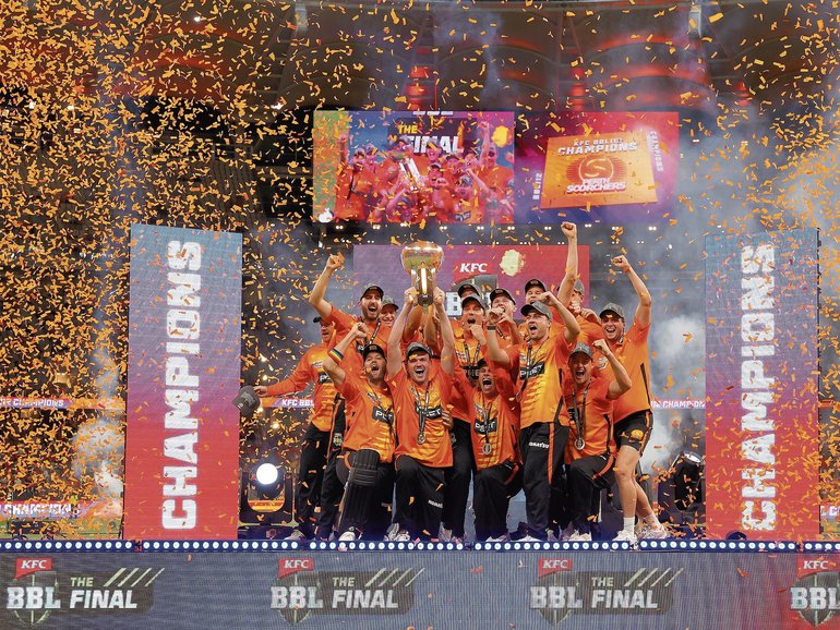 The Scorchers celebrate with the trophy.