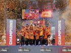 The Scorchers celebrate with the trophy.