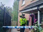 Officers outside the property in Sheffield where the infant’s body was found.