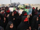 Mourners have carried caskets wrapped in the Iranian flag in the streets of port town Kuhestak. (AP PHOTO)