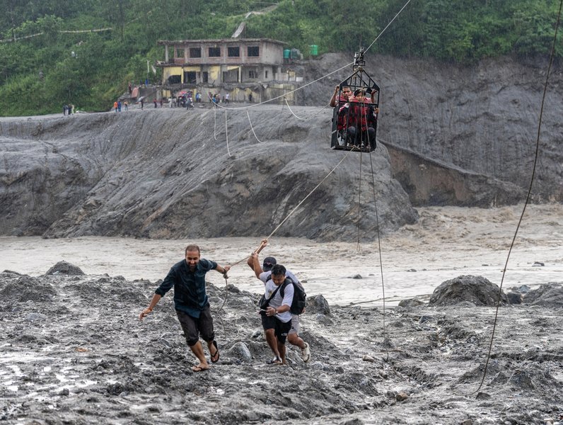 Flood rescue progress in Nepal has been hampered by persistent rain ​and challenging terrain. (AP PHOTO)
