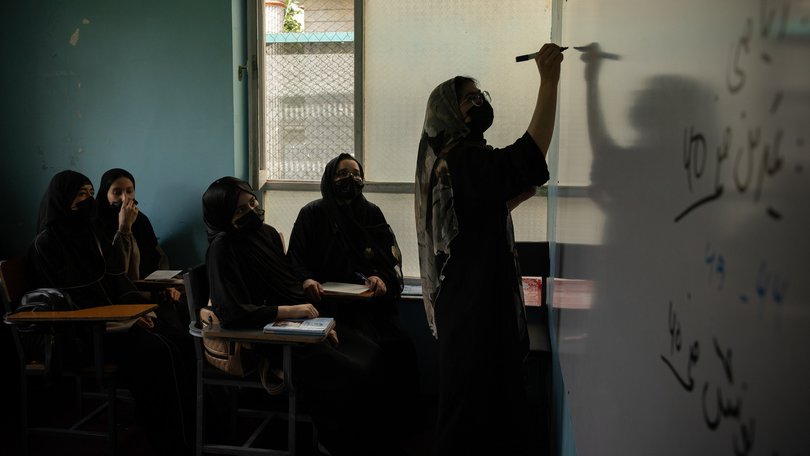 Girls study math inside a secret classroom, hidden inside a girls school in Afghanistan. 
