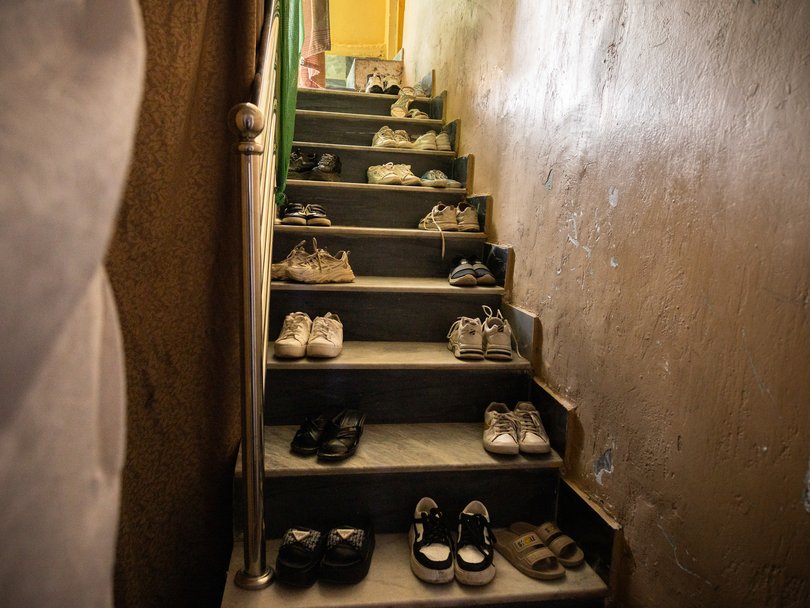 Shoes at the entrance to a secret school.