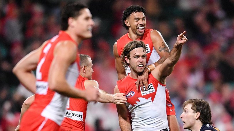 James Rowbottom (centre) trying to split football and his friendship with his housemate Nick Blakey. (Steven Markham/AAP PHOTOS)