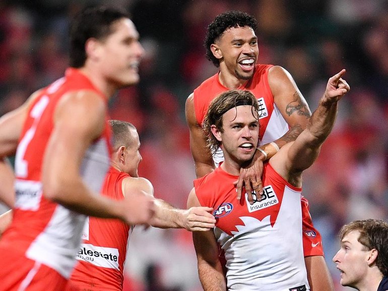 James Rowbottom (centre) trying to split football and his friendship with his housemate Nick Blakey. (Steven Markham/AAP PHOTOS)