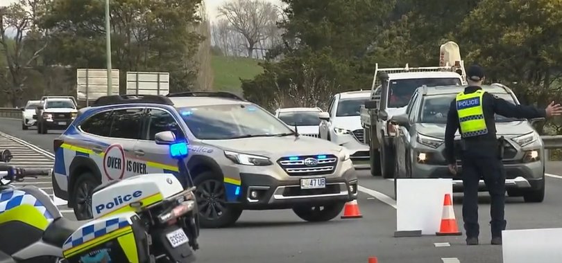 Police diverting traffic at the scene of the crash.