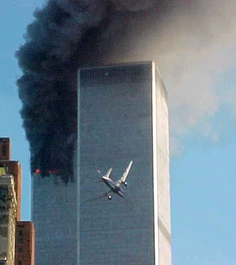 A jet airliner nears one of the World Trade Center towers in New York.