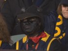 A Crows supporter has come under fire over her costume