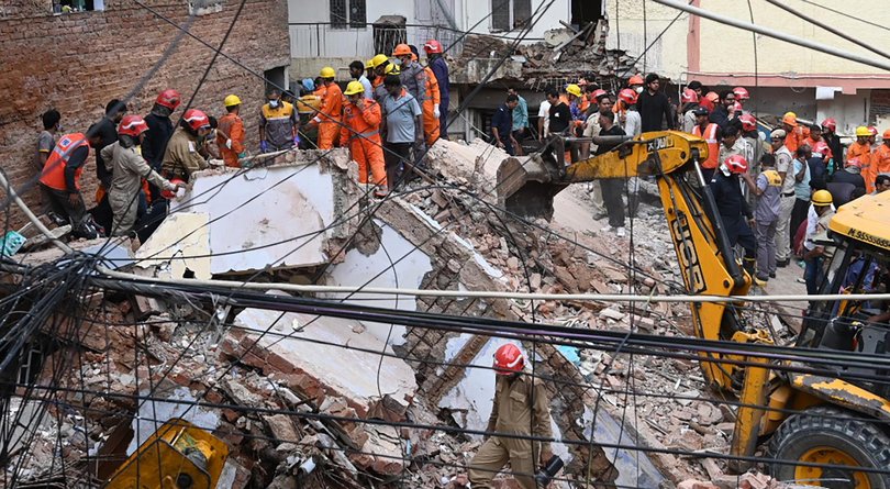 NEW DELHI, INDIA - SEPTEMBER 6: NDRF, local residents and administration officials joined rescue teams after a multi-storey boys' PG hostel collapsed in South-West Delhi on Sunday afternoon, killing five and leaving around 4050 students feared trapped under the rubble, on September 6, 2026 in New Delhi, India. 
