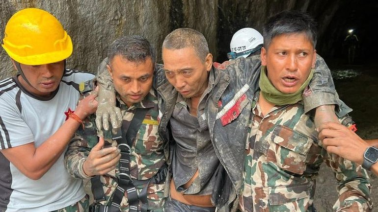 Nepalese rescuers have pulled a third worker alive from inside a tunnel at a hydropower project. 