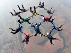 An experienced skydiver has plunged thousands of feet after being knocked unconscious in a terrifying freefall accident.