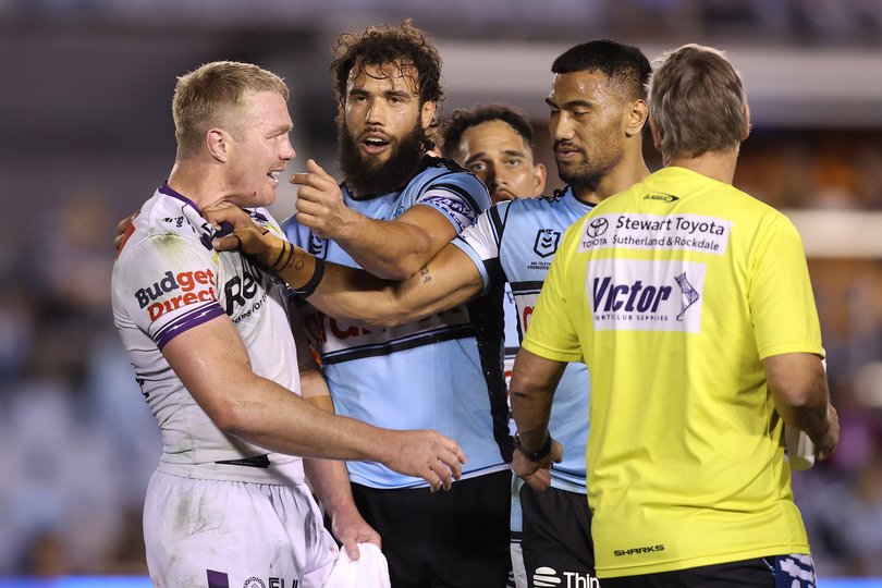 Ronaldo Mulitalo of the Sharks and Josh King of the Storm tussle.