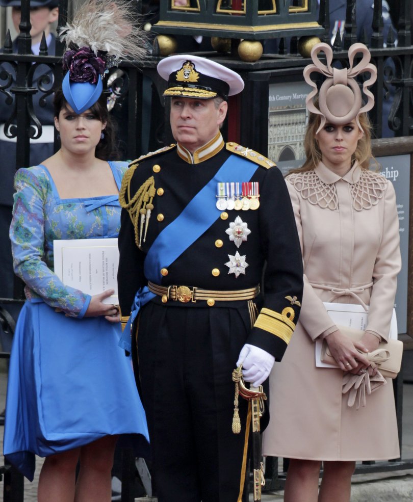 Andrew pictured with his daughter’s Princess Eugenie and Princess Beatrice.