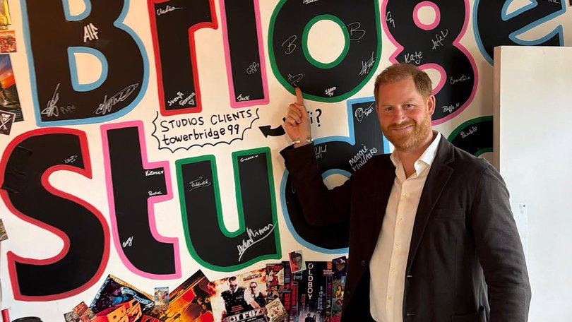 Prince Harry conducted his first official outing on Monday since arriving back in Britain. He was pictured smiling at the Tower Bridge Studios in London and signing a mural on a wall during a pseudo-royal engagement. Unknown