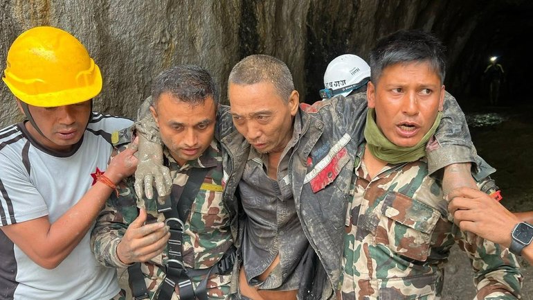 Nepalese rescuers have pulled a third worker alive from inside a tunnel at a hydropower project. 