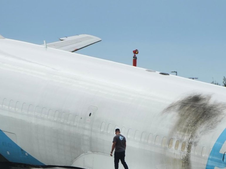 The Amazon cargo plane travelled about 400 metres past the paved runway surface. (AP PHOTO)