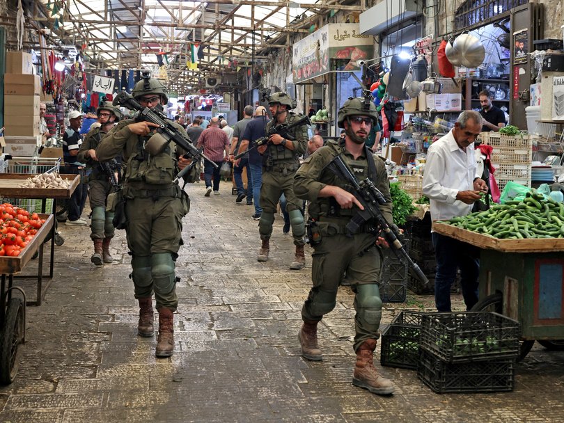 Israeli soldiers carry out a foot patrol through the market, in the Old City of Nablus, in the northern Israeli-occupied West Bank.