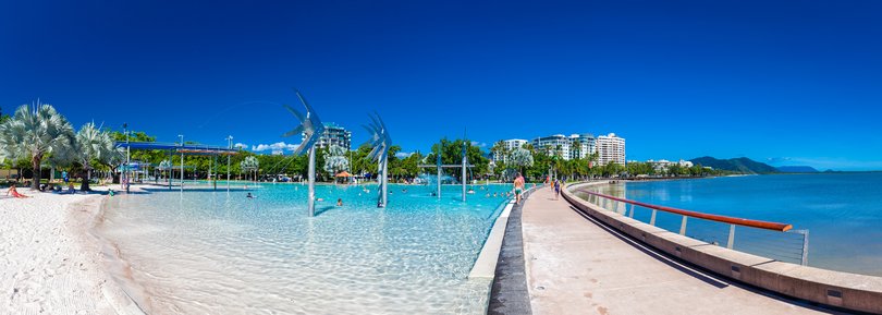 The Esplanade in Cairns with swimming lagoon and the ocean, Queensland, Australia.