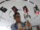 CUPERTINO, CALIFORNIA - SEPTEMBER 09: An attendee takes a video of a display of new Apple iPhone 17 Pros during an Apple special event at Apple headquarters on September 9, 2025 in Cupertino, California. Apple unveiled a new generation of iPhones, updated Apple Watches, and AirPods during a special event at its headquarters. (Photo by Justin Sullivan/Getty Images)