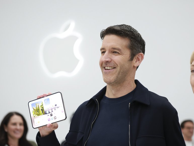 John Ternus, Apple’s new chief executive, holds Apple’s Duo foldable phone at an event at Apple’s campus in Cupertino, Calif., September 9, 2026. A